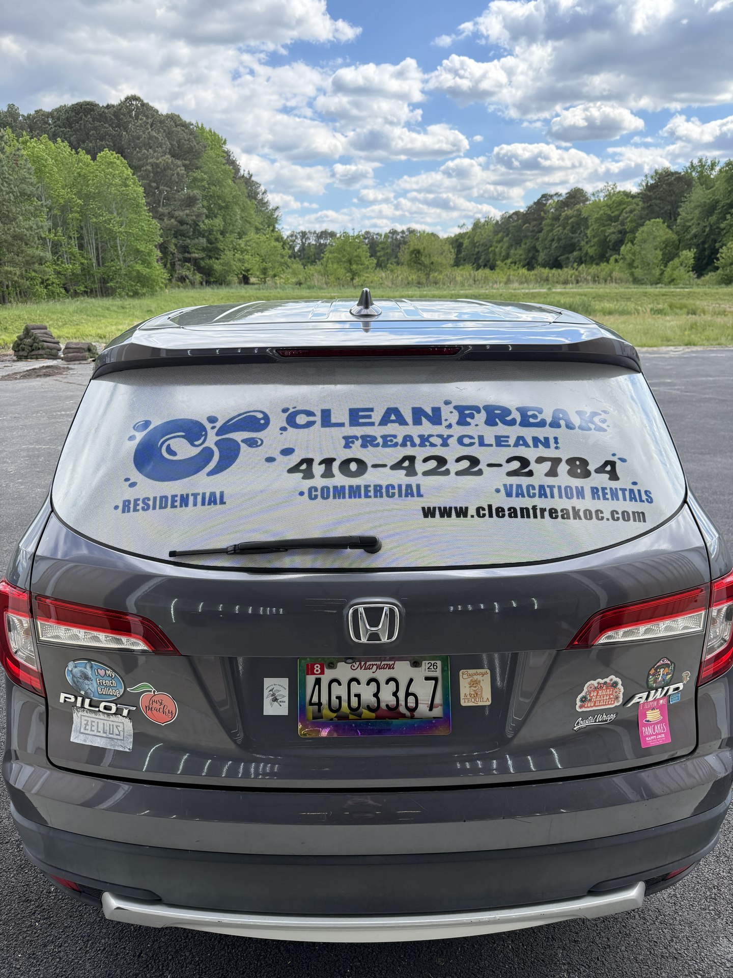 Clean Freak Fleet — rear minivan graphics by Coastal Wraps